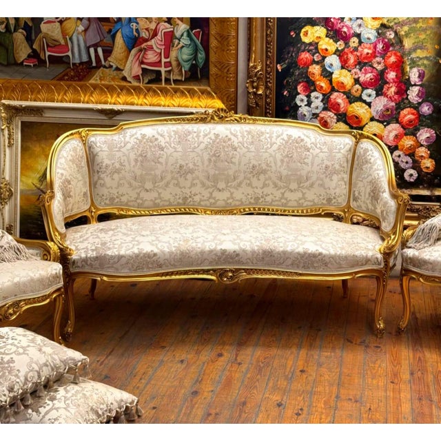 Bring timeless French elegance into your home with this beautiful Louis XV-style sofa, upholstered in a refined white and...