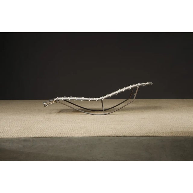 Sculptural bronze 'Waikiki' rocking chaise lounge by Walter Lamb for Brown Jordan. These collectible examples of...