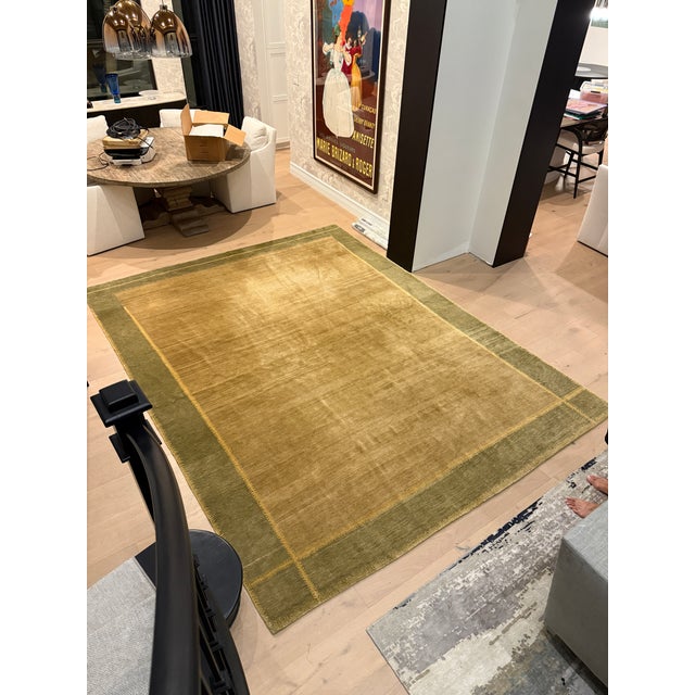 9 x 12 Odegard rug purchased at NYC design center. Great condition. One small flaw, pictured. Golden tan, sage green and...