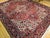 "This vibrant vintage Persian Heriz rug, crafted in the first quarter of the 20th century, presents a rich brick red field...