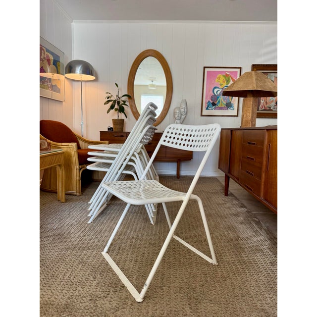 A vintage set of 9 white metal chairs in the style of Egon Eirmann, made in France, circa 1970s. Widely regarded as one of...