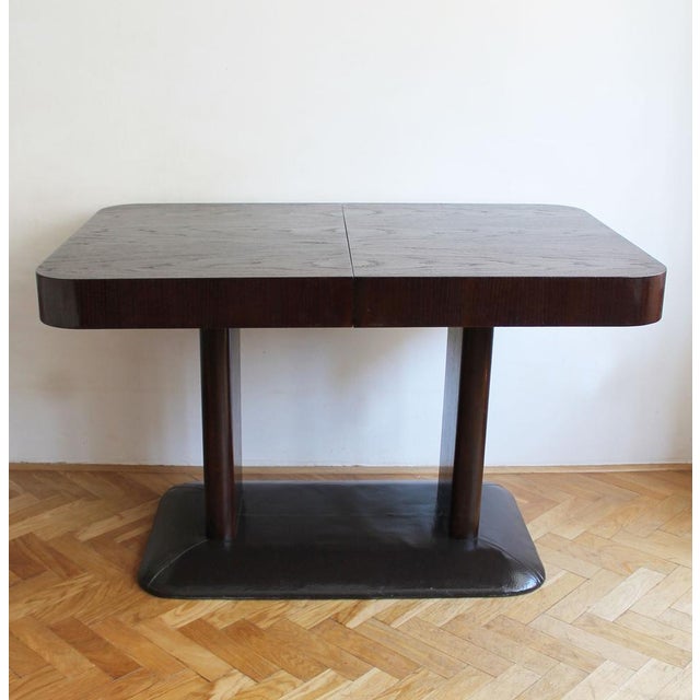 This extendable dining table by up brno is a practical and well-designed piece, made for both everyday use and larger...