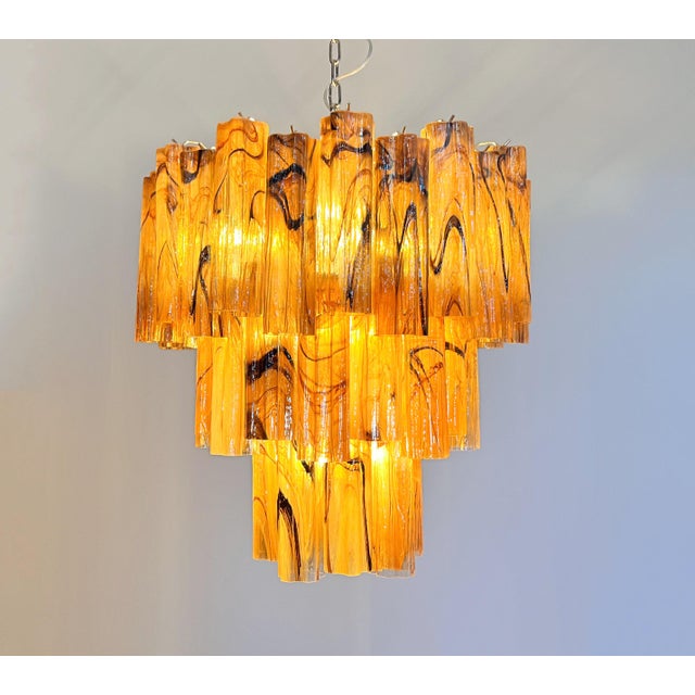 This impressive Italian chandelier features an elegant combination of Murano glass and nickel-plated metal, showcasing...