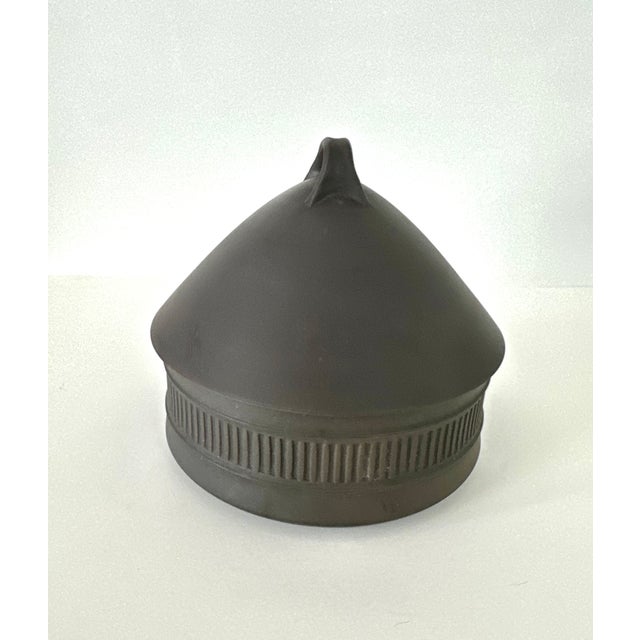 Flamestone 2 quart casserole designed by Jens Quistgaard for Dansk Designs. Matte chocolate brown exterior with pale...