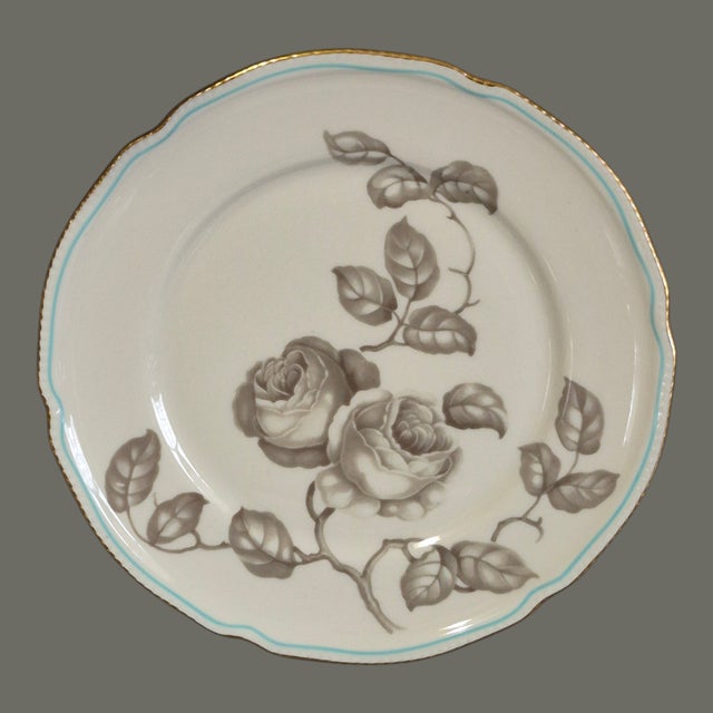 The product described is a set of two round lunch plates from the Castleton Gloria Porcelain collection, featuring a taupe...