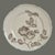 The product described is a set of two round lunch plates from the Castleton Gloria Porcelain collection, featuring a taupe...