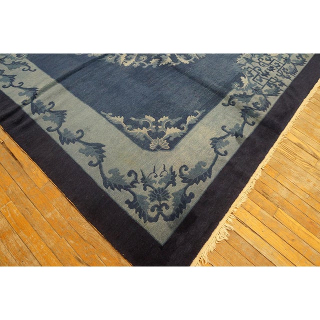 Antique Peking Chinese Medallion Navy 1920s Rug, Circa Date: 1920s. This exceptional piece exemplifies the refined...