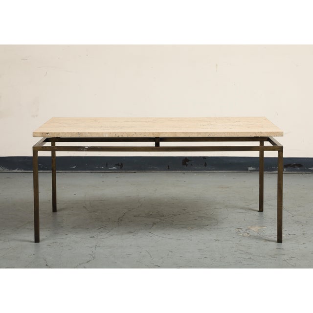 20th century Modernist style coffee table with brass base and travertine top.