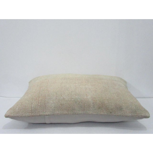 Decorative pillow cover made from a vintage Turkish handknotted rug. Backed with good quality cotton fabric. Pillow...