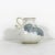 Stunning, vintage studio pottery vase with an organic curved handle and small opening. Signed by the artist on the bottom....