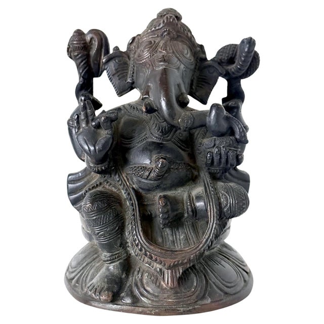 A finely cast statue of Ganesh from late 19th century collected in Kandy, Sri Lanka. The semi-elephant semi-human deity is...