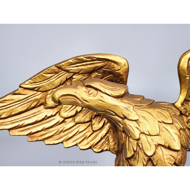 Antique Gold Metal American Eagle Sculpture This eagle sculpture is made of metal with a gold-toned finish. The back can...