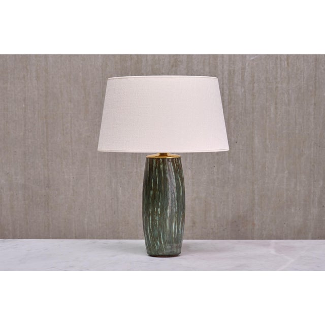 This striking table lamp was designed by gunnar nylund and produced in sweden in the 1960s. Nylund, renowned for designing...