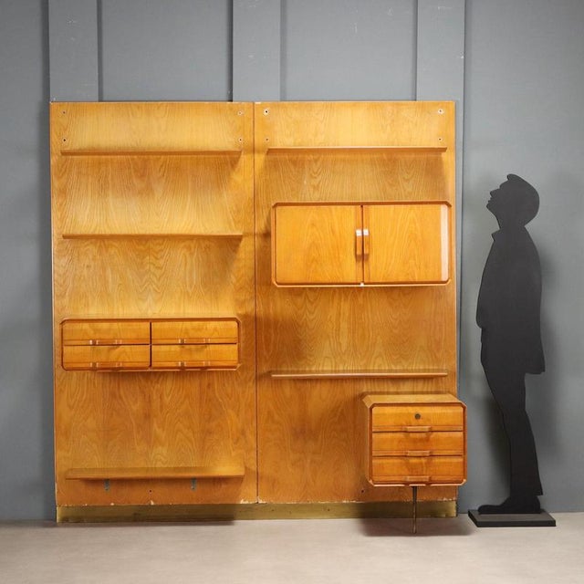 This 1960s-era wall-mounted bookcase is crafted from maple and features a modular design that includes functional shelves...