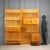 This 1960s-era wall-mounted bookcase is crafted from maple and features a modular design that includes functional shelves...