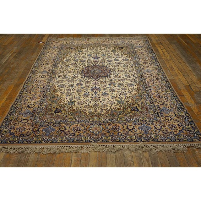 This is an exquisite, mid-sized antique Esfahan rug, dating back to circa 1940. Measuring 5'2" x 8'1", this formal carpet...