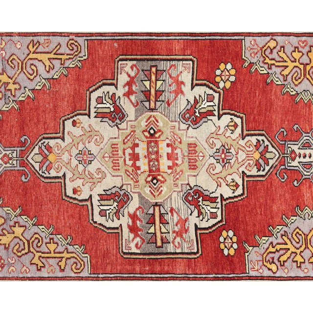 This Vintage Turkish Oushak Runner, measuring 3'1" x 9'7", is handwoven from wool on a wool foundation in the Oushak...