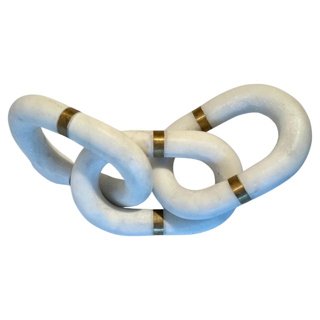 Our newest favorite pieces - Three interlocking hand-carved marble links with a brass detail on each one. The trio make a...