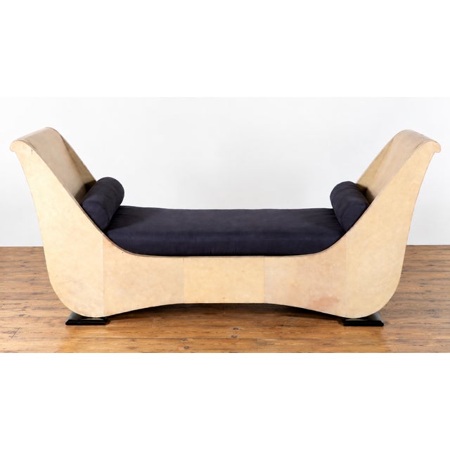 A parchment covered day bed in the manner of Samuel Marx. Mid century fabrication with art deco design language. Seat in a...