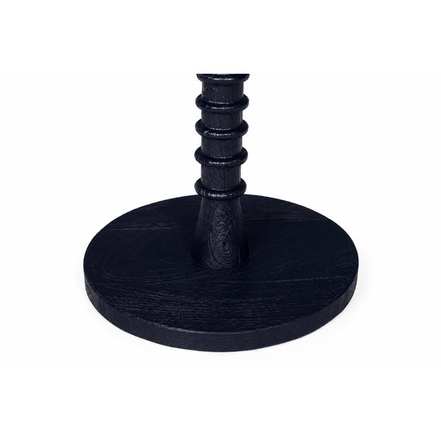 Crafted from rich, natural wood, this compact accent table features a beautifully turned base with a stacked, threaded...
