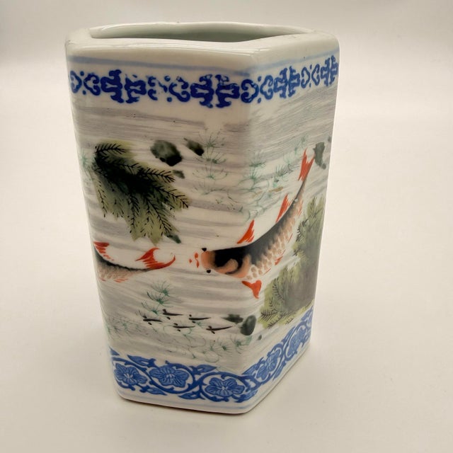 An elegant and finely decorated Chinese porcelain hexagonal brush pot dating to the early 20th century. The vessel...