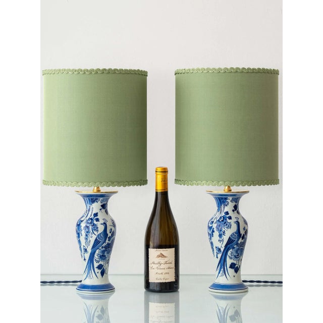 Pair of Royal Delft blue and white hand-painted table lamps, topped with custom made drum lampshades in a luminous light...