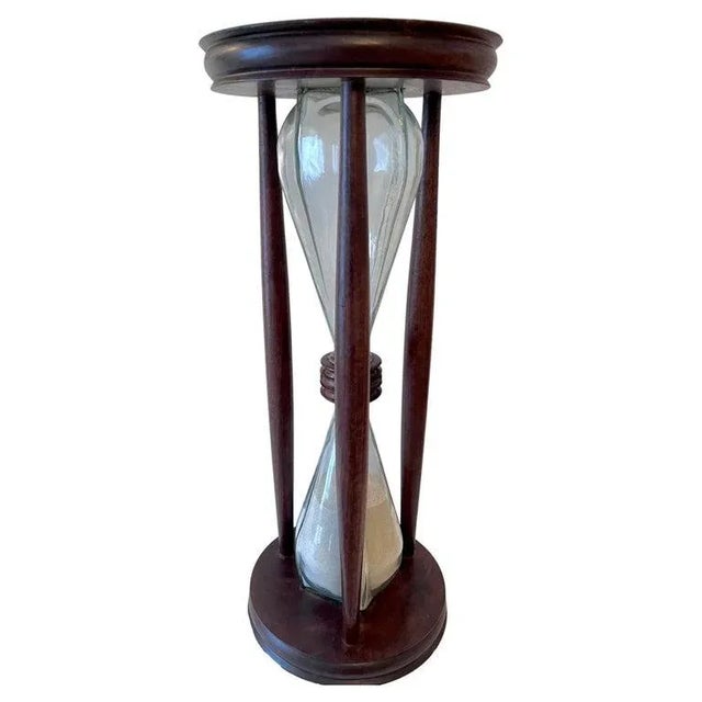 Hour Glass or Sand Timer of solid wood frame, in Mahogany or Walnut. The piece is a compliment to any space and because of...