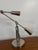 Elevate your workspace with the timeless, industrial sophistication of the Ralph Lauren Home RL '67 Boom Arm Desk Lamp....
