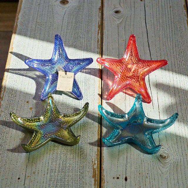 This set of four starfish-shaped dishes by Akcam is made of glass and features a beautiful multicolor design, perfect for...