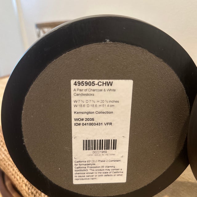 Product Overview A pair of charcoal and white candlesticks with turned detailing on a circular base. The original pieces...