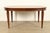 A gorgeous French Regency Louis XVI style carved cherry wood extension dining table By Drexel USA, Circa 1960s Measures:...