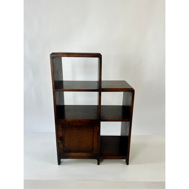 Pair of modernist art deco bookcase / shelving unit in oak. English, c.1930 Asymmetric design with a stepped profile and...