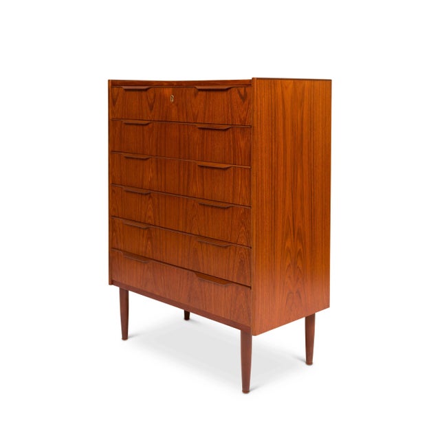 A beautiful 1960s Danish Mid-Century Teak Tallboy dresser With exquisite wood-grain detail. This chest of drawers has six...