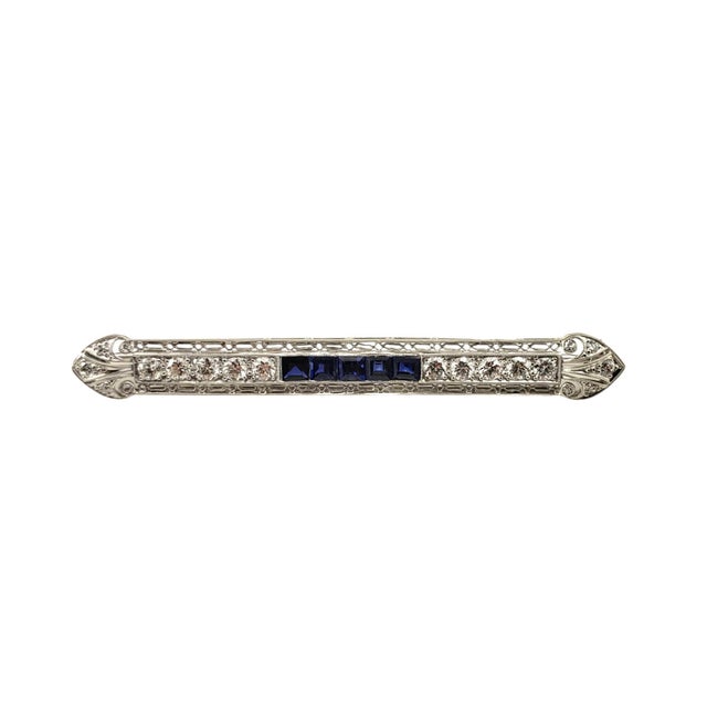 Platinum Sapphire and Diamond Filigree Brooch/Pin JAGi Certified- This stunning brooch features 5 square cut natural blue...