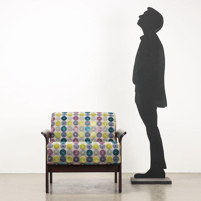 Armchair, with stained beech wood frame, foam padding, upholstery (not original from the period) with elegant patterned...