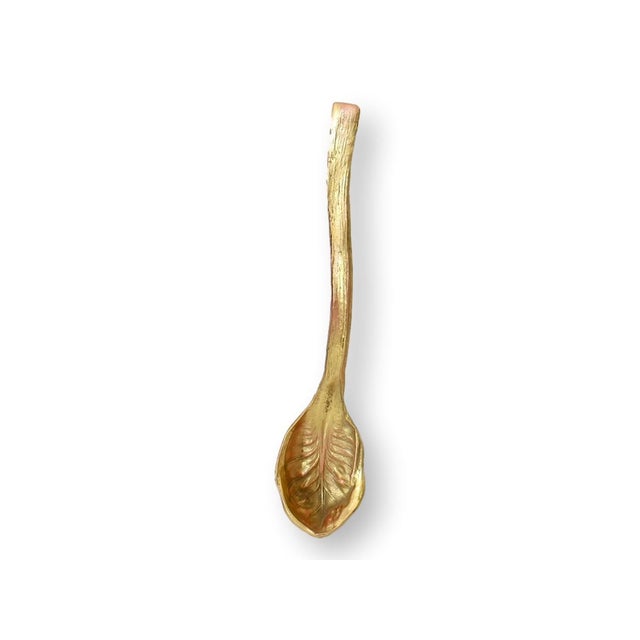 A beautifully detailed three-piece gilt metal grape leaf set featuring a sculptural leaf-form bowl with two matching leaf-...
