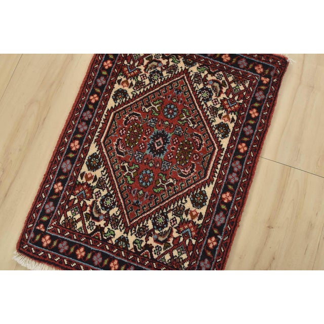 An authentic vintage traditional Bidjar rug hand-knotted with fine wool and natural dyes. This intricately woven oriental...
