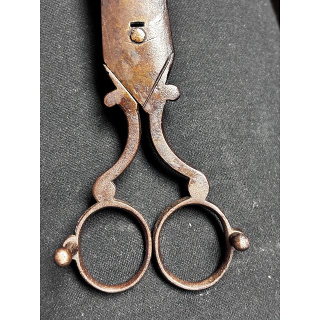 An authentic 18th century hand-forged iron candle wick trimmer with attached wick catcher, from a Setauket, Long Island...