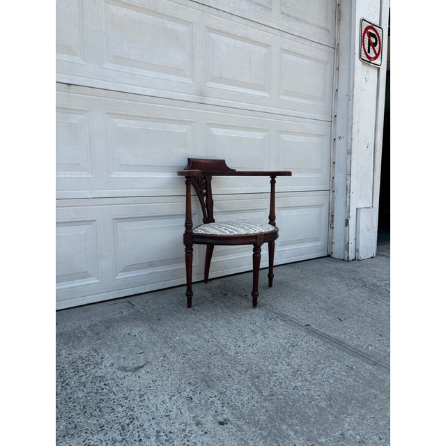 We have a beautiful vintage mahogany corner chair for sale. It features classic Sheraton Revival and Federal style design....