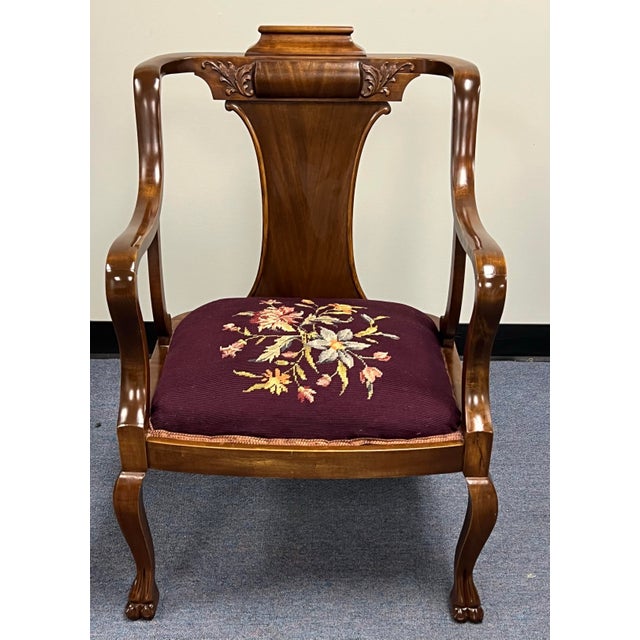 Gorgeous late 19th century carved mahogany Georgian arm chair. Graceful curved arms with subtle cabriolet legs and carved...