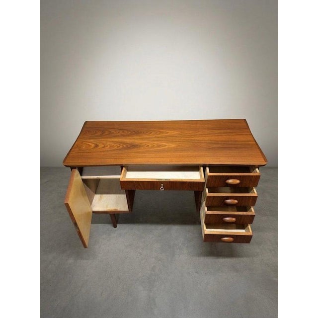 Elevate your workspace with this stunning Danish mid-century modern teak desk, a fabulous piece that blends exceptional...