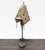 Add a touch of culture to your home with this unique table lamp. It features a sculpted tribal-style base with charming...