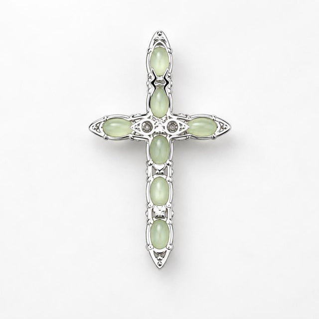Refined pendant featuring cabochon-cut green chrysoberyl Cats Eye stones set in 18k white gold. The chrysoberyl stones...