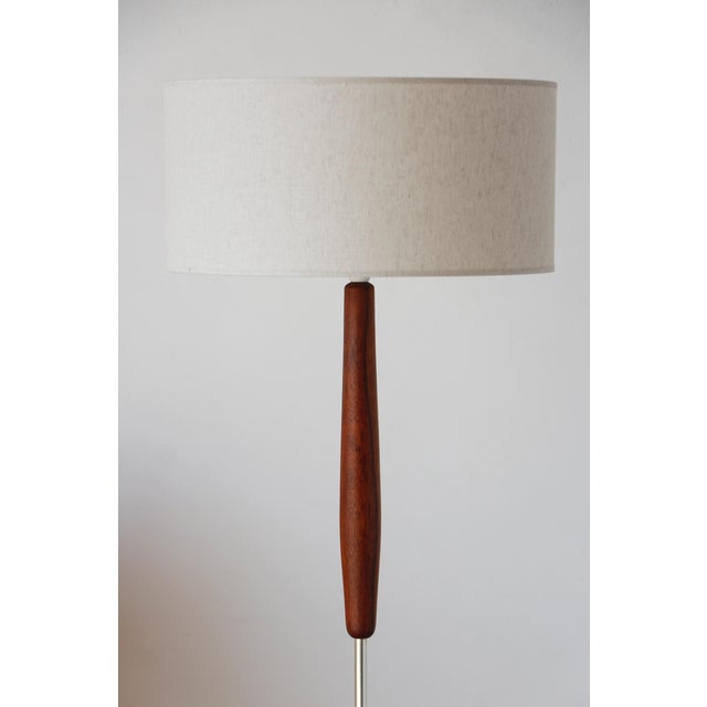 Vintage scandinavian teak and metal light fixture (1960s) succumb to the timeless charm of mid-century design with this...