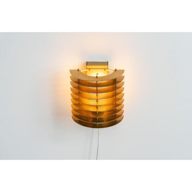 Wall light by Borens (Sweden, 1980s). A refined example of Scandinavian modernism, this wall lamp features layered metal...