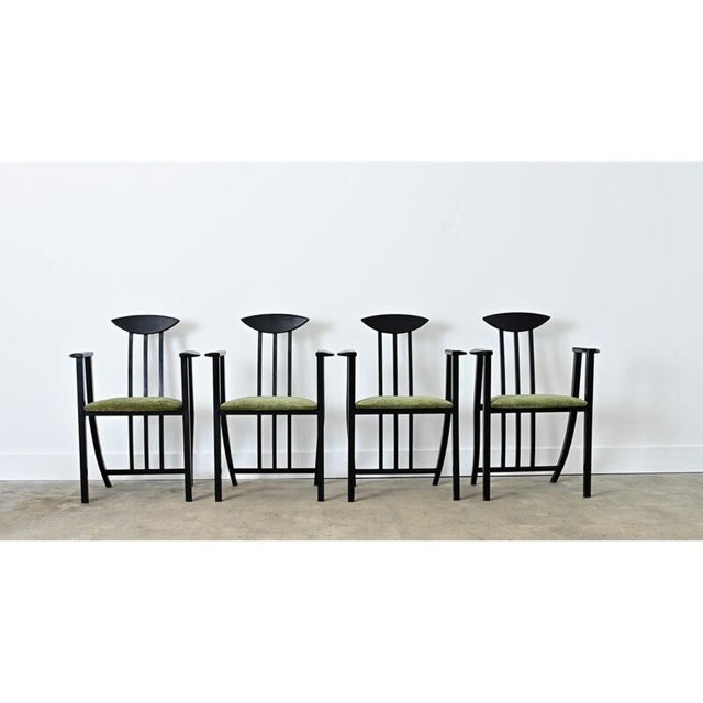 A very unusual set of four dining armchairs from Italy–1980s, the height of Postmodern and Memphis design– with stylistic...