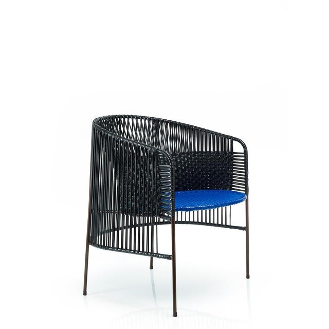 Set of 2 black caribe lounge chair by sebastian herkner. Materials: galvanized and powder-coated tubular steel. Pvc...