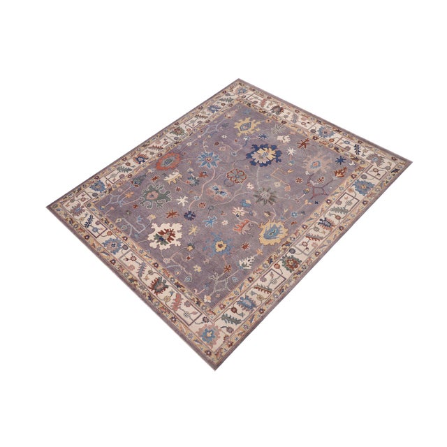 Enhance your home with this exquisite hand-knotted Kazak rug, crafted from fine hand-spun wool and dyed with all-natural...