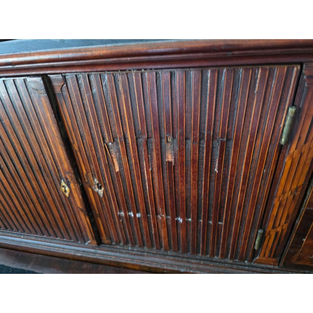 An elegant 19th-century Federal-style mahogany tambour secretary featuring beautifully figured mahogany veneers, working...