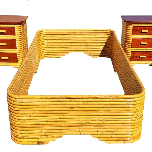 This full-sized bed frame attributed to Seven Seas Rattan Company (1938 to 2011) in the 1940s. It features a stacked...